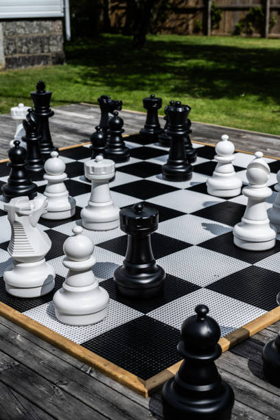 istock Pieces of a large garden chess set.. 1670363679