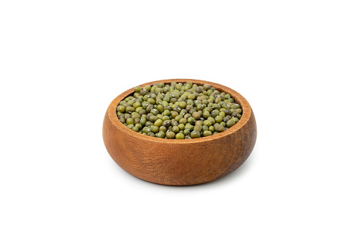 Mung beans in wood bowl isolated on white background.