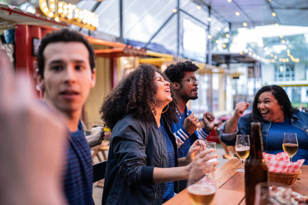 istock Friends watching a match at bar 1670575090