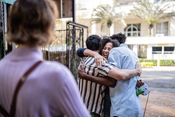 istock Friends embracing on restaurant entrance 1670579230