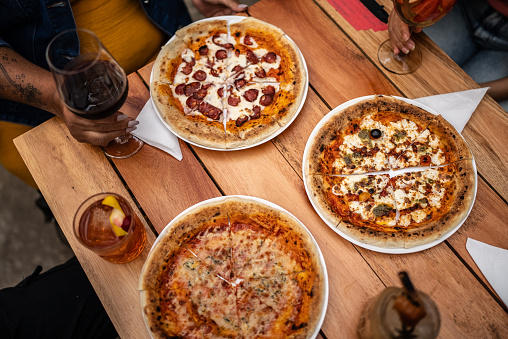 High angle view of pizzas on table at pizzeria