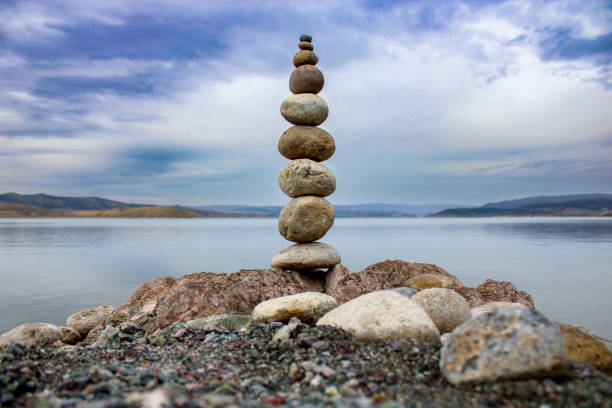 istock zen stones on the beach. stack of stones on beach 1670648647