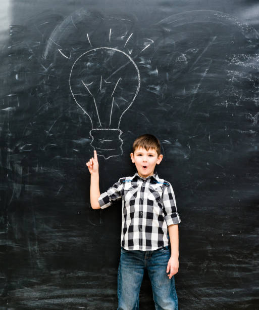 istock cute little boy with finger up having an idea 1670667526