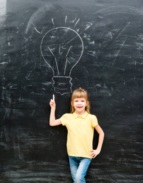 istock cute little boy with finger up having an idea 1670667529