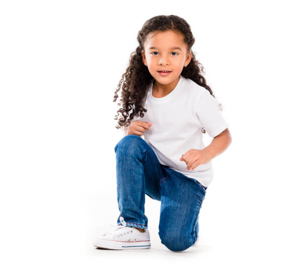 istock smiling little cute girl knelted on one knee 1670667539