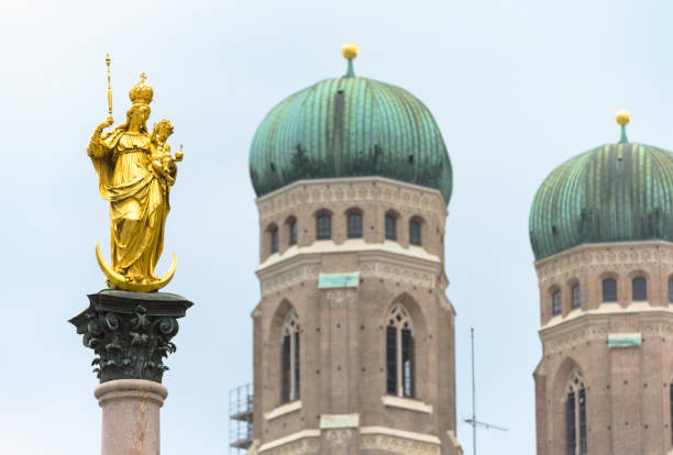 istock Virgin Mary statue on sky background at Marienplatz, Munich, Germany 1670700692