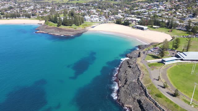 Aerial drone view of Kiama on the New South Wales South Coast showing Kiama’s Surf Beach and Kendalls Beach on a sunny day