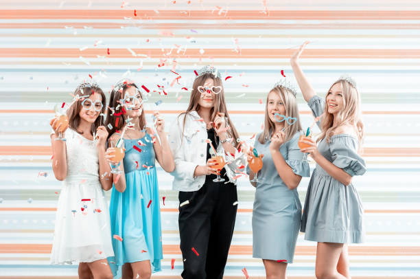 istock Cute young girls in confetti 1670750245