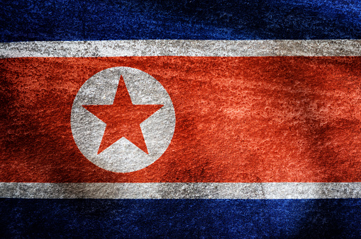 Grunge and dirty background D.P.R. Korea  national flag.