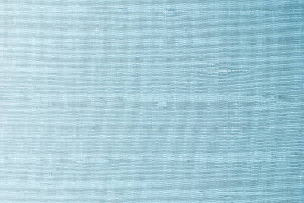 istock Blue silk fabric background of satin texture cotton cloth pattern with shiny gradient silky woven detail 1670790882