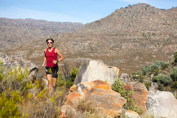 istock Female athlete running in the mountains 167080218