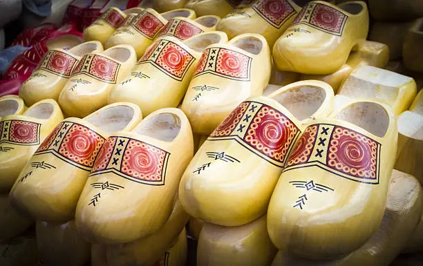 Photo of Dutch traditional wooden shoes with ornament, clogs, symbol of t