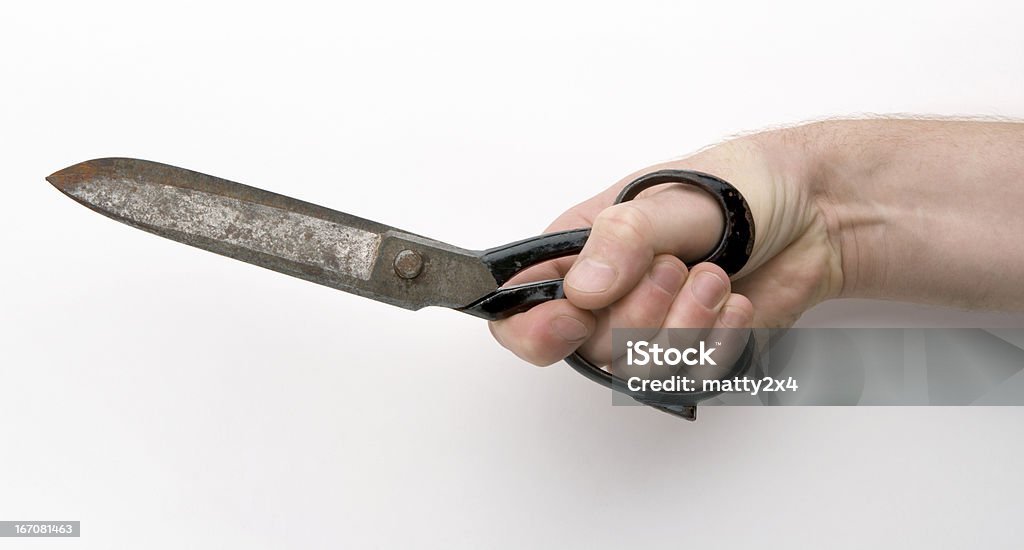 Rusty old fashion Scissors. Being held - Closed A pair of old fashioned dress making scissors that have been left to rust, with Clipping Path Antique Stock Photo