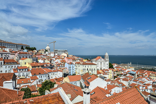 View from Miradouro das Portas do Sol on Alfama district and river Tagus in Lisbon, Portugal