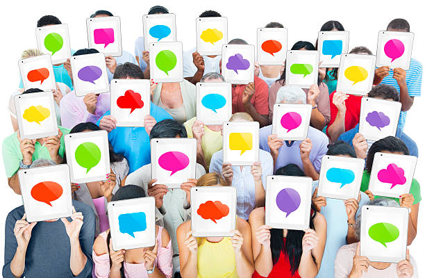 istock Group of people holding tablets with colored speech bubble 167082167