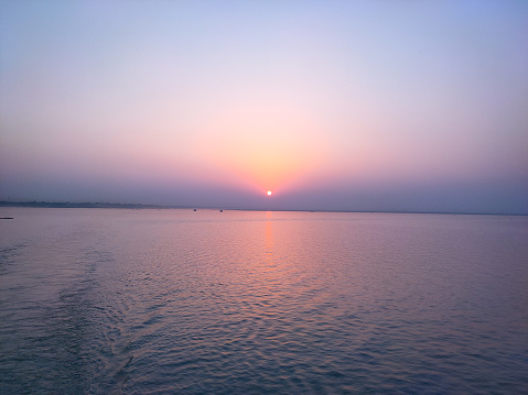 This image captured from a ferry at Padma river, Bangladesh. The sky at sunset is beautiful.