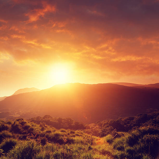 Summer sunset Summer sunset with hills and wonderful clouds. Ireland, Killarney National Park (Ring of Kerry) orange sunset stock pictures, royalty-free photos & images