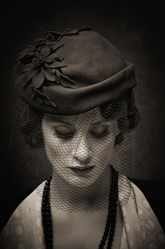 sad retro woman wearing lace and hat