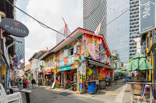 Singapore - August 30,2023 : Haji Lane is a shopping street in the heart of Singapore Kampong Glam Arab Quarter, it famous for shops, cafes, bar and restaurants. People can seen exploring around it.