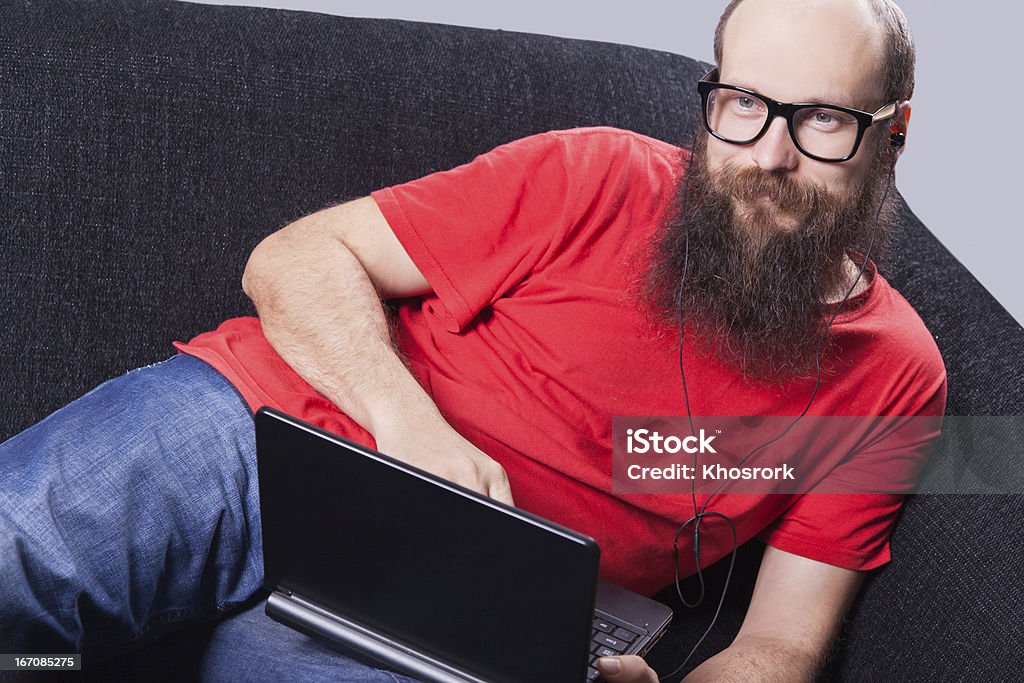 Mann liegt auf der Couch ausruhen und genießen-(Serie) - Lizenzfrei Brille Stock-Foto