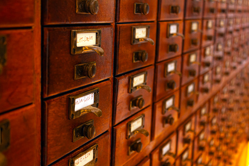 Library catalogue drawers with labels and handles at a public library