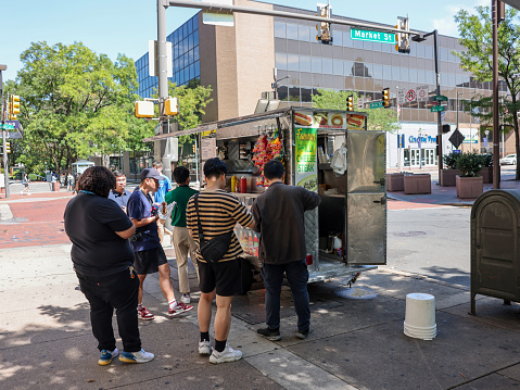 Philadelphia, Pennsylvania, USA - Sep 2, 2023: A food truck of the famous Philly cheesesteak on Market Street of Center City, Philadelphia