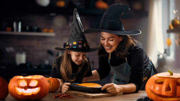 istock family preparing for Halloween. 1671062875