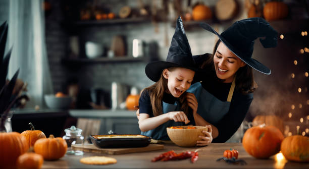 istock family preparing for Halloween. 1671062876