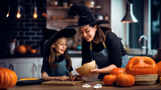 istock family preparing for Halloween. 1671062879