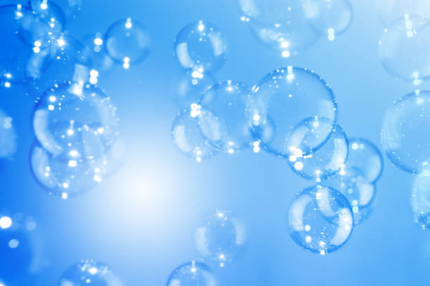 istock Beautiful Transparent Shiny Blue Soap Bubbles Floating in The Air. Abstract Background, Celebration Festive Backdrop, Refreshing of Soap Suds Bubbles Water. 1671142693