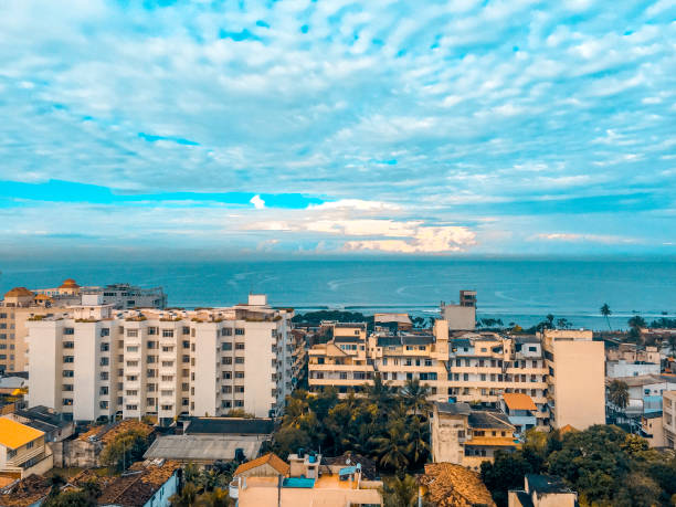 istock Sunset over city and sea 1671157117