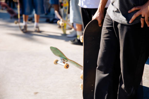 istock Close-up skateboarder balancing on skateboard at skatepark 1671174066