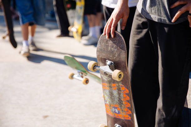 istock Close-up skateboarder balancing on skateboard at skatepark 1671174067