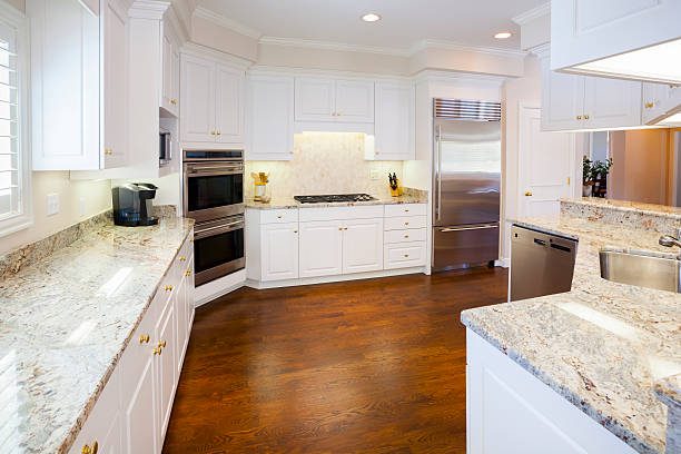 istock Bright Spacious Kitchen with Marble Counters, Hardwood Cabinetry 167118549