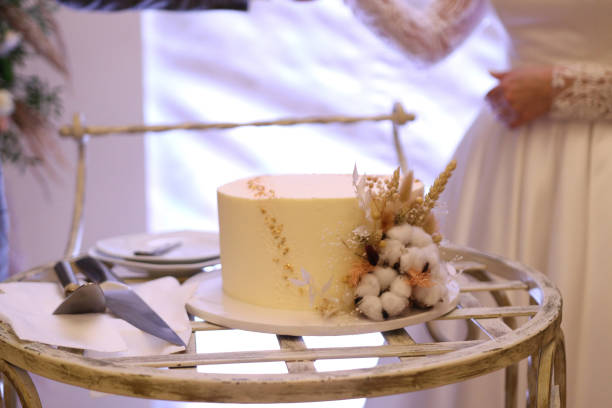 istock A beautiful wedding cake decorated with white roses. Wedding celebration. 1671190632