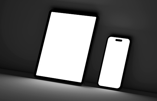 Blank Smartphone and Digital Tablet With Light Coming From The Screen