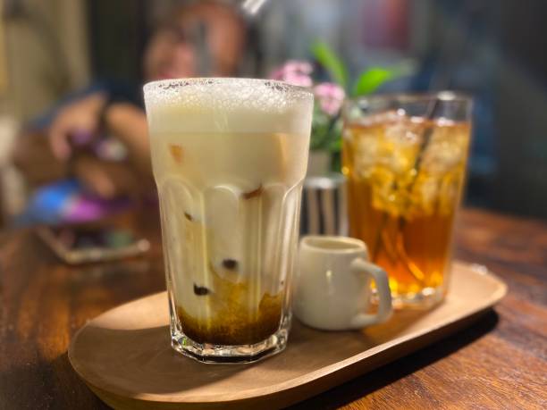 istock An iced latte on table with blur ice tea at the background. 1671245120
