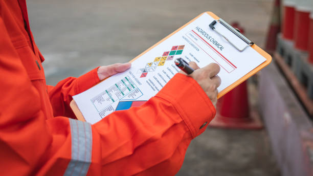 istock Checking on the chemical hazardous material form. Industrial safety working. 1671256714