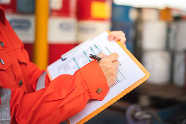 istock Checking on the chemical hazardous material form. Industrial safety working. 1671256716