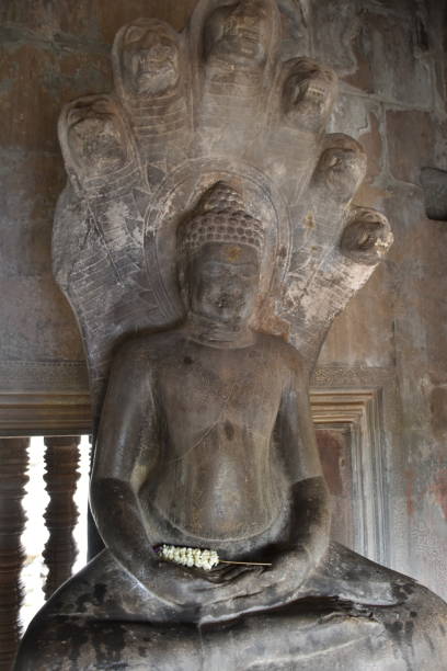 istock Buddha Statue in Dhyana Mudra with Seven-Headed Serpent 1671266914