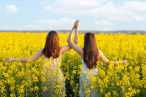 two young woman in agricultural field