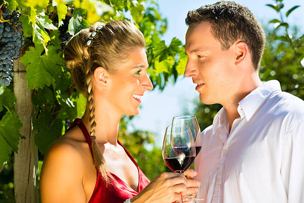 istock Woman and man in vineyard drinking wine 167127576