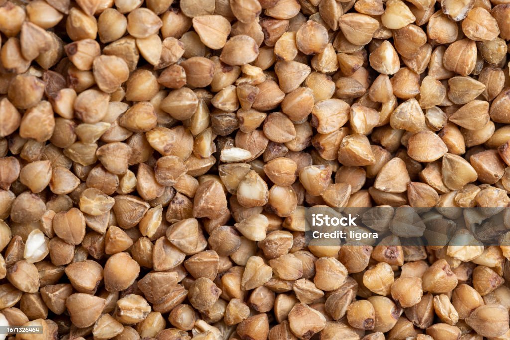 A large amount of harvested buckwheat A large amount of harvested buckwheat, not cooked buckwheat kernels in the kitchen Agriculture Stock Photo