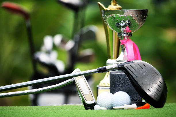 istock Collection of golf equipment resting on green grass 1671394485