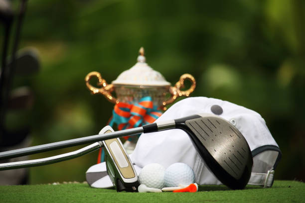 istock Collection of golf equipment resting on green grass 1671394519