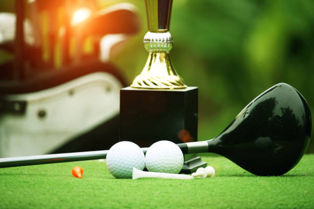 istock Collection of golf equipment resting on green grass 1671395355