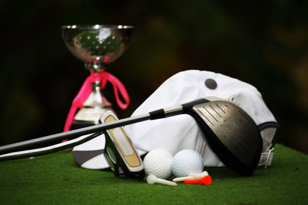 istock Collection of golf equipment resting on green grass 1671396389