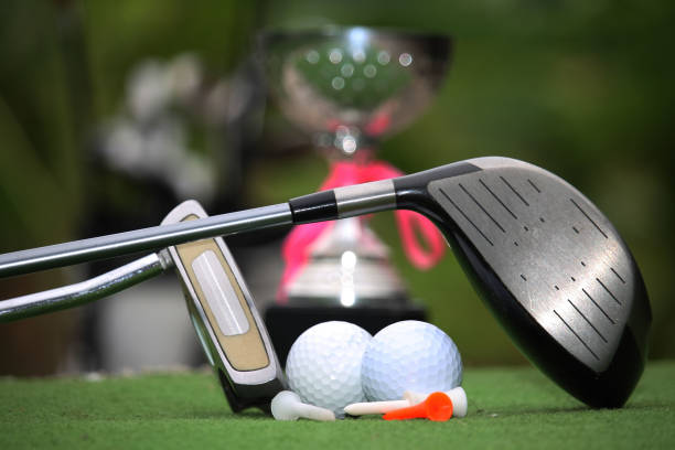 istock Collection of golf equipment resting on green grass 1671396391