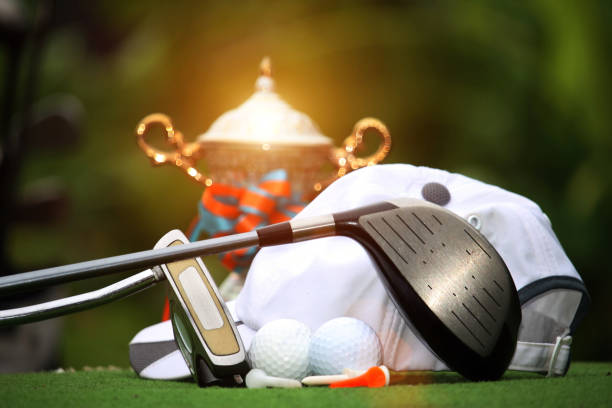 istock Collection of golf equipment resting on green grass 1671396409