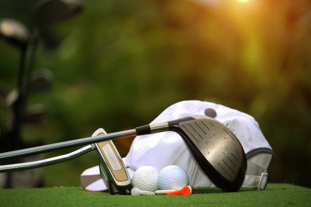 istock Collection of golf equipment resting on green grass 1671396412